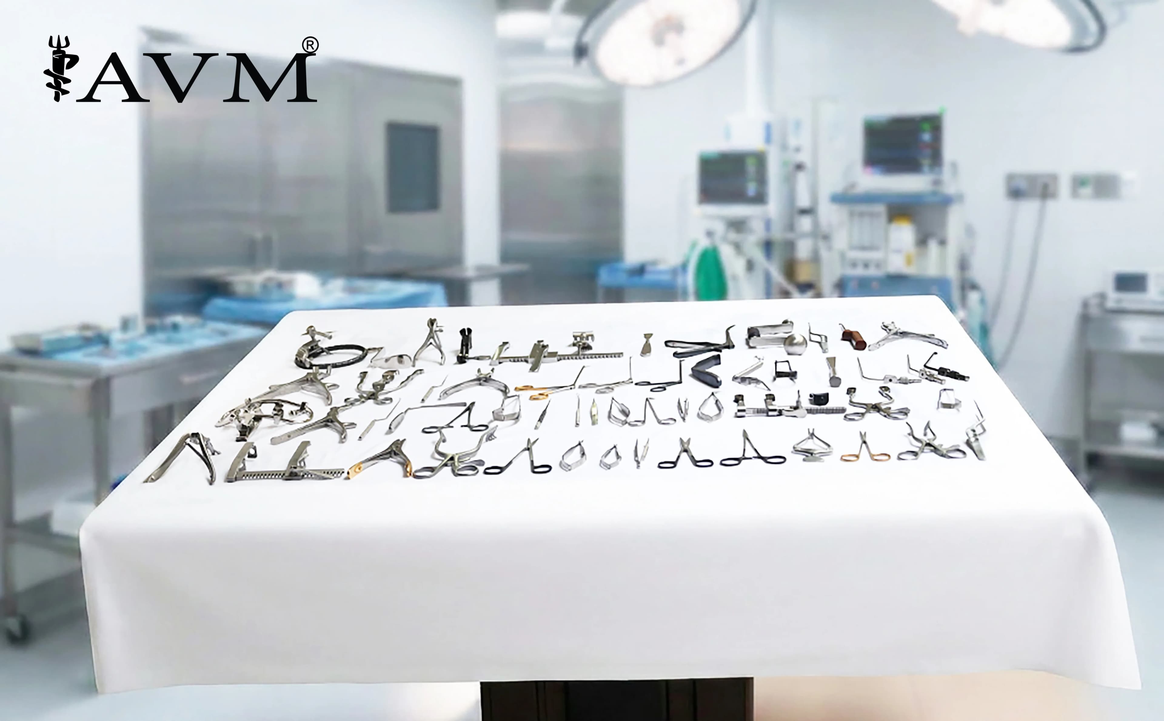 A wide-angle view of AVM surgical instruments laid out on a sterile tray in an operating theatre